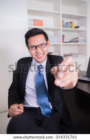 Business man writing touch screen PC on white background