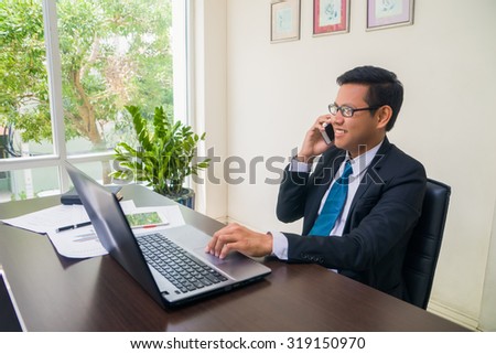 asian business executive working in office.