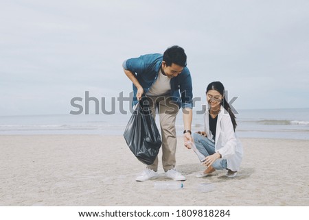 Similar – Image, Stock Photo Young woman cleaning beach area and showing plastic bottle lids in hand