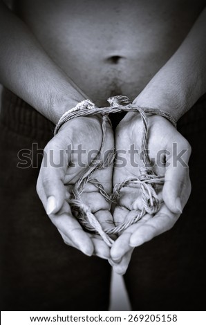hand with rope heart in black  a white color