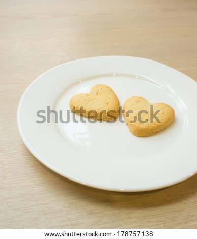 Heart cookies on white plate .Composition for text.