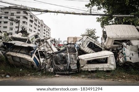 Crushed truck in car graveyard