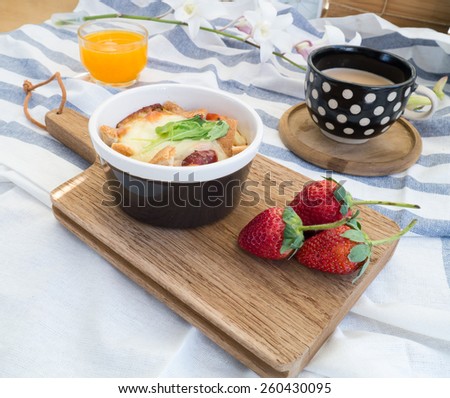 Set of breakfast with toasts , egg, sausage, coffee and fruits