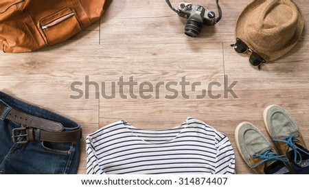 Top view of Vintage clothing and accessories on the wooden background ( Composition and space for text )