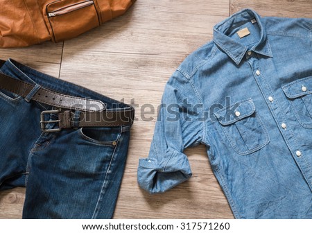 Top view of Vintage clothing and accessories on the wooden background
