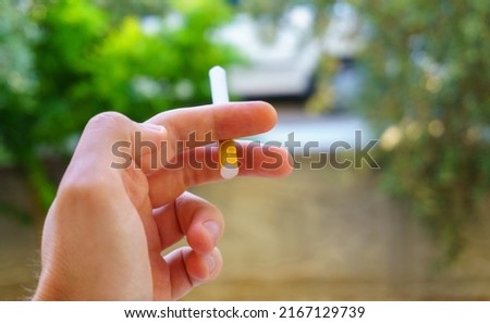 Someone smoking cigarette on nature background. Ironic photo of fresh breath versus toxic breath. Harmful behavior for lungs. Bad habits causes cancer concept idea. Photo stock © 