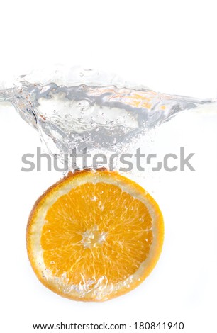 dropped orange in water isolated