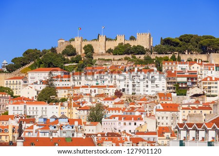 Sao Jorge (Saint George) castle over the old rooftops of Lisboa downtown. Portugal