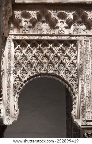 SEVILLA, SPAIN - AUGUST 19, 2011: Mudejar arch detail. Courtyard of the dolls in the Royal Alcazar of Seville, Spain. UNESCO World Heritage Site