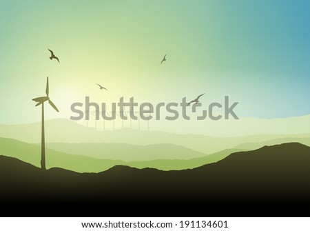 Landscape with wind turbines against a sunrise sky