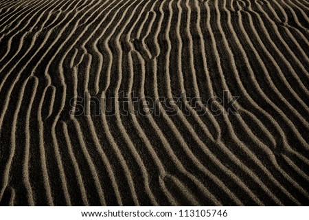 A Dark Sand Ripple Nature Background, Death Valley; California, USA