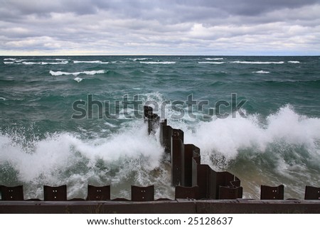 Waves Rolling Toward The Seawall At Point Betsie Lighthouse On Lake Michigan