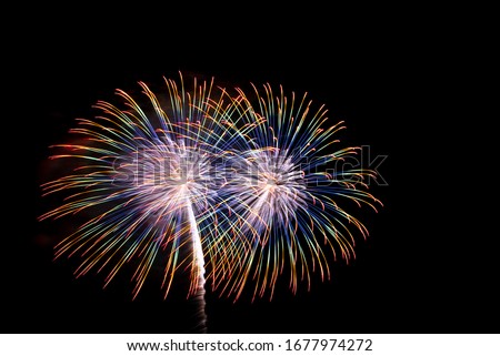 Similar – Image, Stock Photo Fireworks explode in two circles with yellow sparks from red smoke