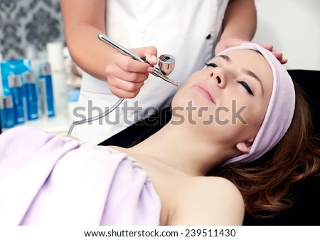 woman face treatment in medical spa center