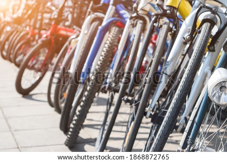 Similar – Image, Stock Photo Bikes in a row at the roadside