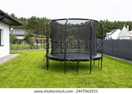 Similar – Image, Stock Photo Trampoline on a lawn in the sunset with two kids