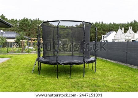 Similar – Image, Stock Photo Trampoline on a lawn in the sunset with two kids