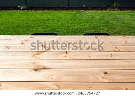 Similar – Image, Stock Photo Wet garden table made of rustic wood covered with light frost