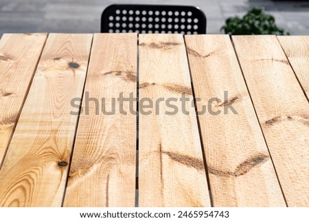 Similar – Image, Stock Photo Wet garden table made of rustic wood covered with light frost