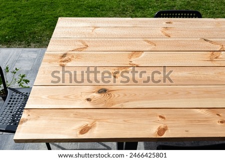 Similar – Image, Stock Photo Wet garden table made of rustic wood covered with light frost