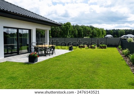 Similar – Image, Stock Photo garden table made of light wood with bistro chairs with flower pot with plant with pink blossoms in front of a shop in the old town of Detmold in East Westphalia-Lippe