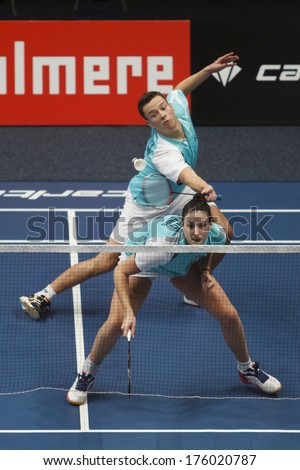 ALMERE - FEBRUARY 1: Samantha Barning (front) and Jorrit de Ruiter (back) reach the semi finals in the National Championships badminton 2014 in Almere, The Netherlands on February 1, 2014.