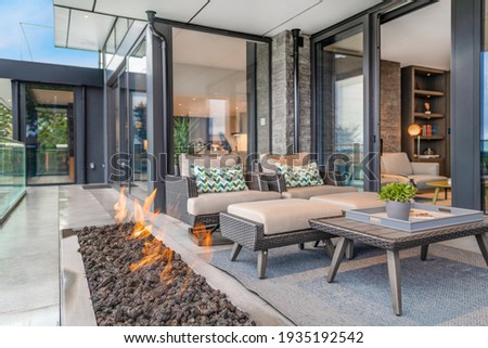 Exterior deck with large open gas fire