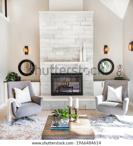 Modern new living room with fireplace and mirrors
