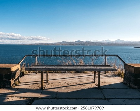 Similar – Image, Stock Photo public wooden bench, seat with the inscription “it is too late to change the bench ” ambiguity