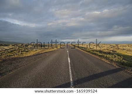 empty icelandic driving road on a sunny weather