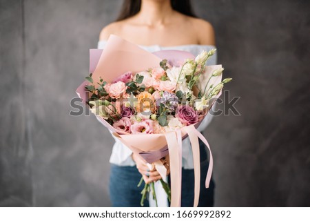 Similar – Image, Stock Photo Beautiful eustoma flowers bouquet on orange