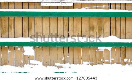 background wooden fence in the snow