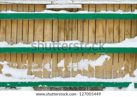 background wooden fence in the snow