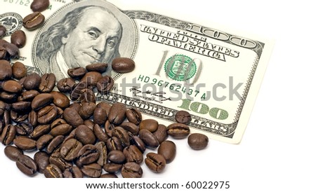 dollar on amid scattered coffee beans packing dollars.