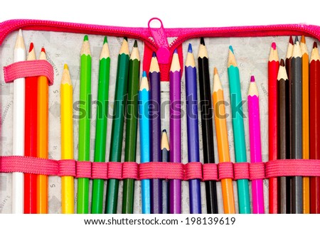 colored crayons on white background