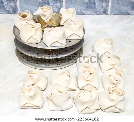 steamed dumplings of dough with meat