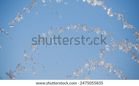 Similar – Image, Stock Photo white bubbling water fountain in front of blue sky