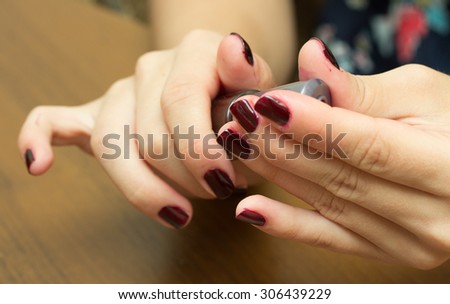 painting fingernails with varnish