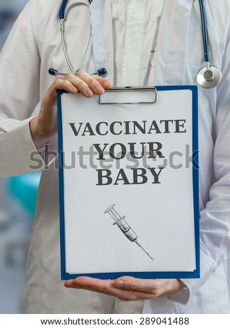 Pediatrician doctor holds clipboard and gives advice to vaccinate baby