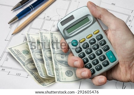 Man needs take a loan for architectural project of house and is calculating his money and funds