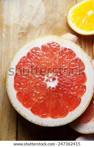 red grapefruit citrus dessert,Fresh grapefruit with slices on a wooden table