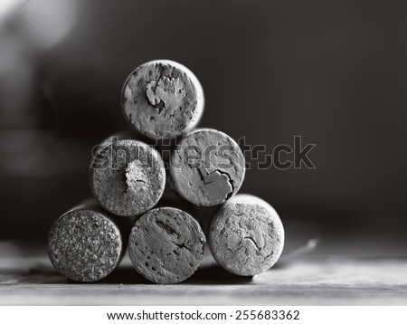 stack of used wine corks black and white close-up with shallow depth of field
