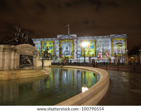 LONDON - APRIL  21: Buckingham Palace projection shows the portrait of Queen Elizabeth and self-portraits of young people in the art project Face Britain on April 21, 2012 in London