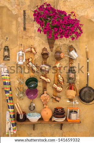 Pots and pans and other household objects on wall