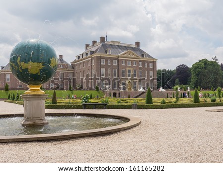 APELDOORN, NETHERLANDS - JUNE 14: View on palace Het Loo with visitors in the gardens on June 14, 2013. Built in the 17th century and now a tourist attraction it is still owned by the royal family.