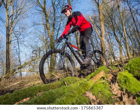 ALMERE, NETHERLANDS - FEB. 3, 2014: Mountain biker test riding a brand new  state of the art electric powered mountainbike which uses a motor and provides a smooth and easy ride on rough terrain