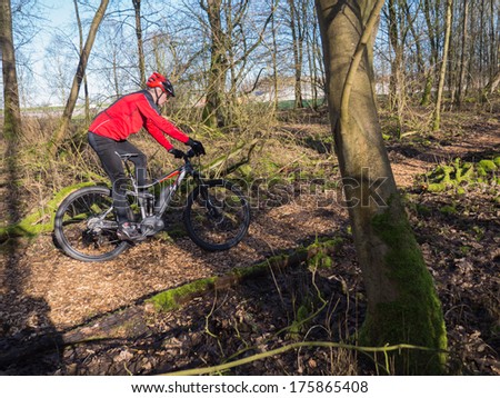 ALMERE, NETHERLANDS - FEB. 3, 2014: Mountain biker test riding a brand new  state of the art electric powered mountainbike which uses a motor and provides a smooth and easy ride on rough terrain