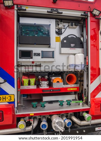 ALMERE, NETHERLANDS - 12 APRIL 2014: Part of the interior of a modern Dutch fire engine showing tools and equipment on display during the first National Security Day held in the city of Almere