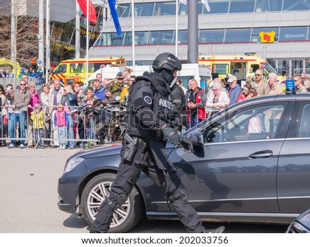 ALMERE, NETHERLANDS - 12 APRIL 2014: SWAT team during a demonstration of an enacted robbery during the first National Security Day held in the city of Almere