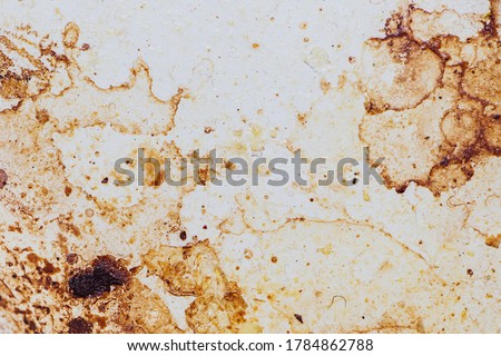 Texture of dirty stains and grease on white stove. Spots of fat on a white background